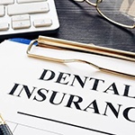insurance paperwork for the cost of dental implants in Huntington Beach
