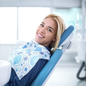 Female patient smiling after biomimetic procedure