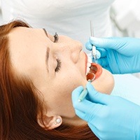 woman receiving teeth cleaning