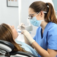 Woman getting a tooth-colored filling in Huntington Beach 