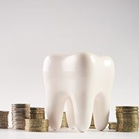 A tooth that symbolizes the cost of cosmetic dentistry in Huntington Beach