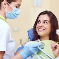 Patient visiting dentist for dental crowns in Huntington Beach