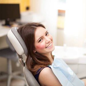 Smiling woman in dental chair