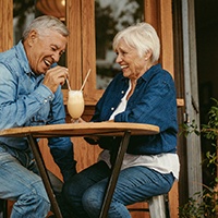 Senior couple sharing a milkshake