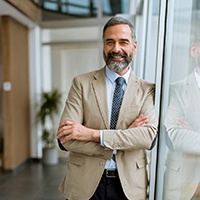 Man smiling in an office building