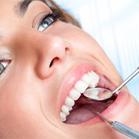 Woman receiving dental exam