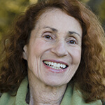 Senior woman enjoying long-term benefits of dental implants