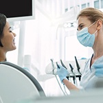 dentist and patient discussing cost of dental implants in Huntington Beach