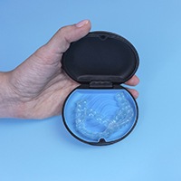 Invisalign in Huntington Beach in case on blue background