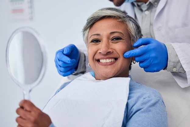 Close up of a dental mirror examining teeth