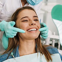 Woman smiling in the dental chair
