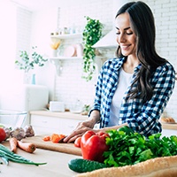 woman cutting vegetables