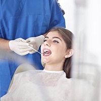 Lady receiving dental examination