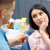 woman with toothache talking to her dentist
	The Root Canal Process
	