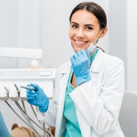 dentist smiling toward the camera 
	