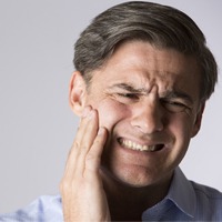 Manwith tooth pain 