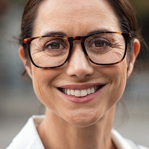 Woman smiling after scaling and root planing in Huntington Beach