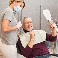 man talking to dentist about cost of veneers in Huntington Beach