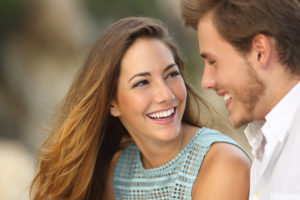 couple with dazzling smiles