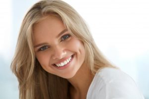 Woman’s beautiful smile after visit to cosmetic dentist in Huntington Beach