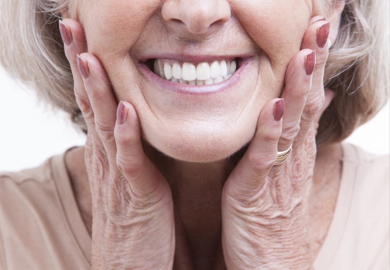 older woman smiling with dentures