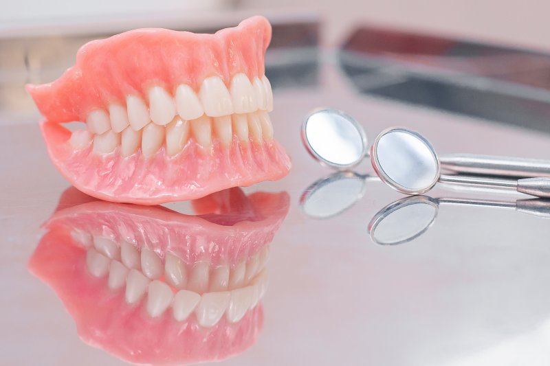 A close-up of a pair of dentures on a desk