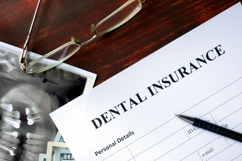A close-up of a dental insurance form on a desk