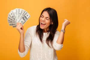 a woman who used her tax refund to invest in a beautiful smile 
