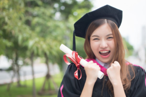 a graduate showing off her smile 