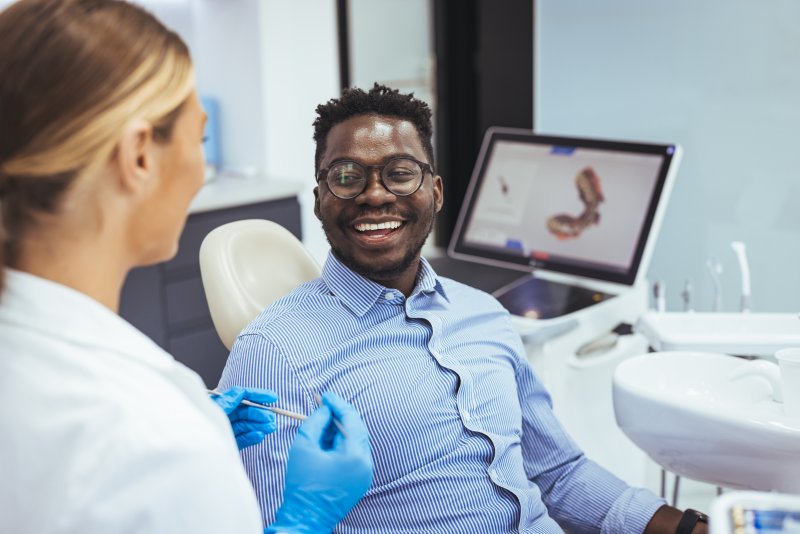 Patient smiling with his cosmetic dentist