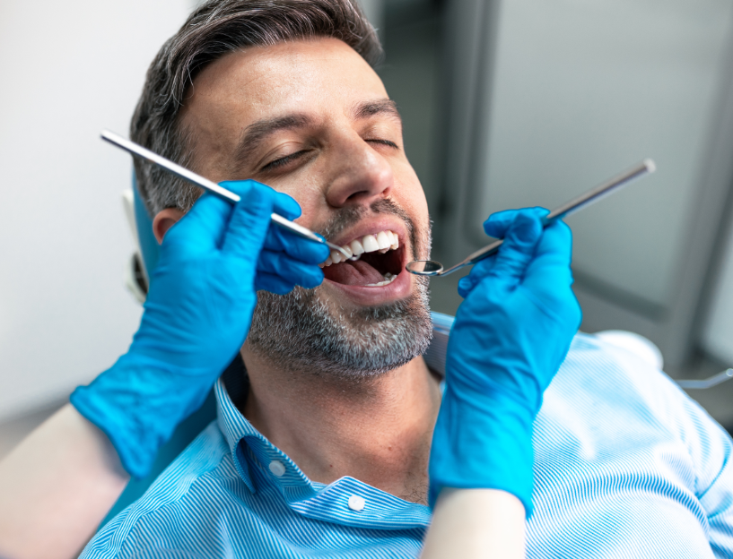 Patient in dental chair, undergoing exam